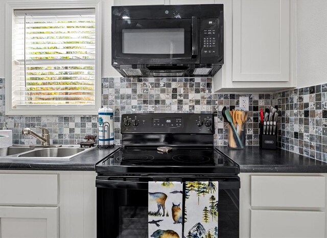 kitchen featuring decorative backsplash, sink, white cabinets, and black appliances