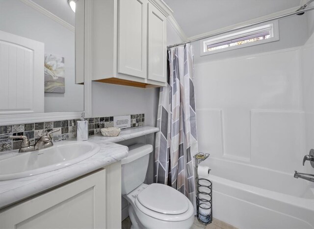 full bathroom featuring tasteful backsplash, shower / bath combination with curtain, toilet, vanity, and ornamental molding