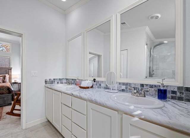 bathroom featuring walk in shower, tasteful backsplash, tile patterned flooring, crown molding, and vanity