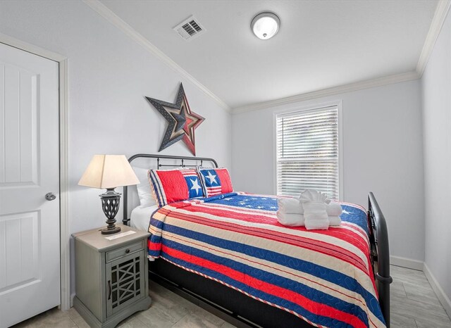 bedroom featuring ornamental molding