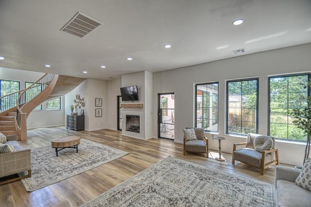 living room with plenty of natural light and light wood-type flooring