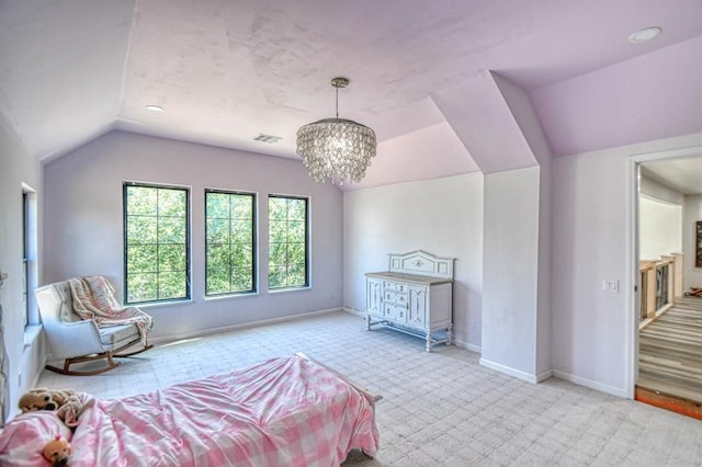 bedroom featuring lofted ceiling and a chandelier