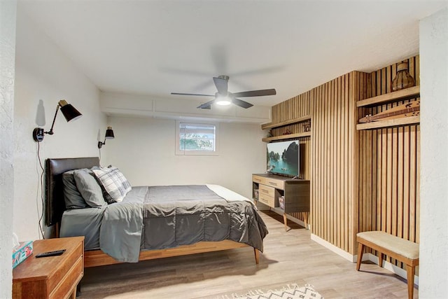 bedroom with light wood finished floors and ceiling fan