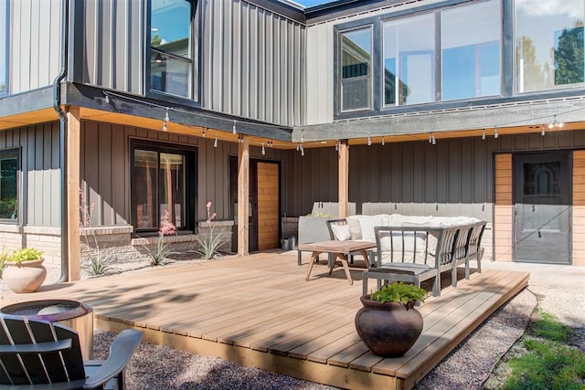 wooden terrace featuring outdoor lounge area