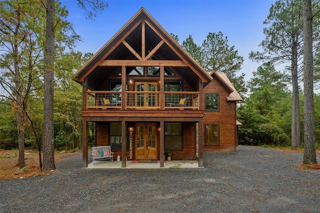 rear view of house with french doors and a patio