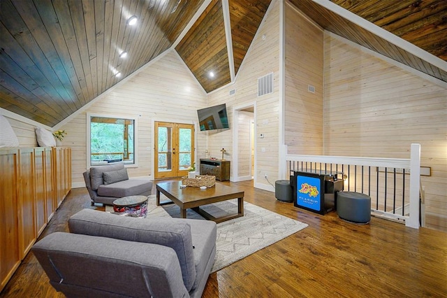 living room with wood-type flooring, high vaulted ceiling, wood walls, and wood ceiling