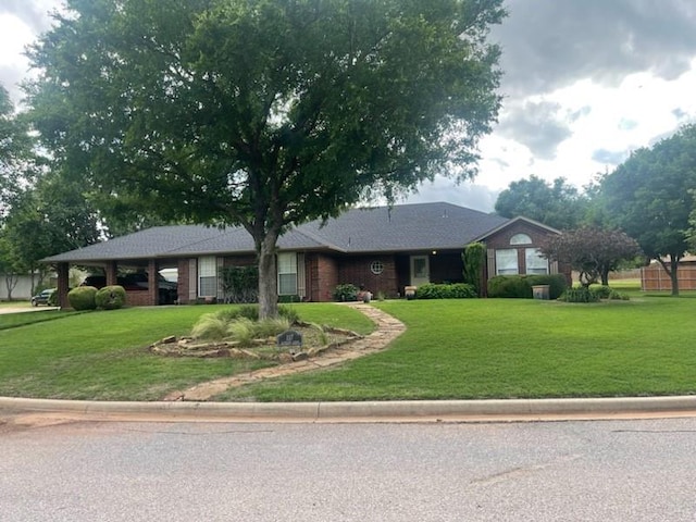 ranch-style home featuring a front yard