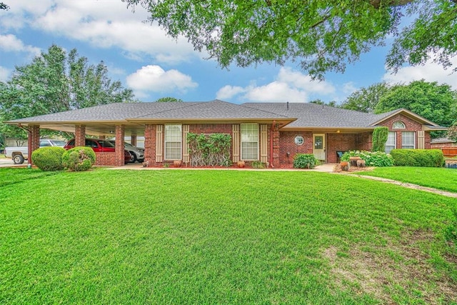 ranch-style house featuring a front lawn and a carport