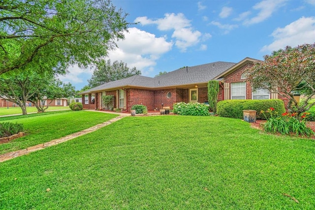 single story home with a front lawn