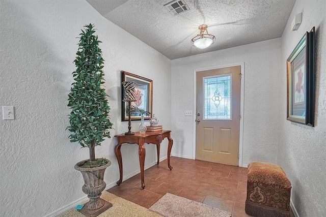 entrance foyer with a textured ceiling