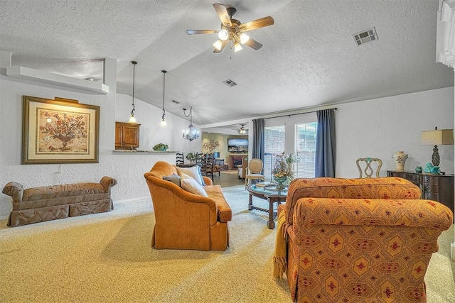 carpeted living room featuring ceiling fan, a textured ceiling, and vaulted ceiling