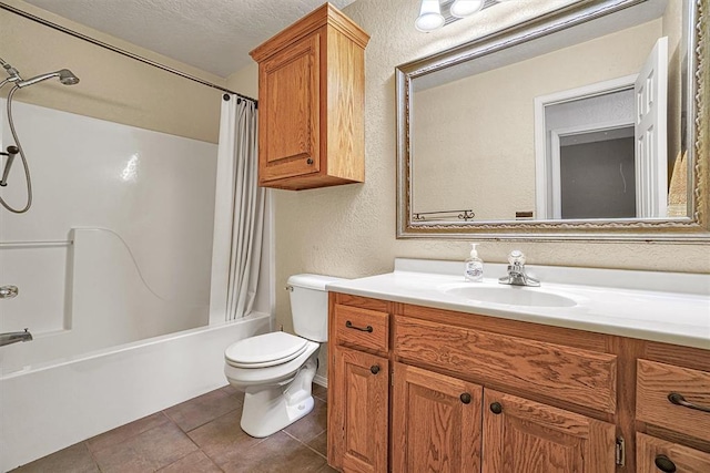 full bathroom with tile patterned floors, a textured ceiling, toilet, vanity, and shower / tub combo