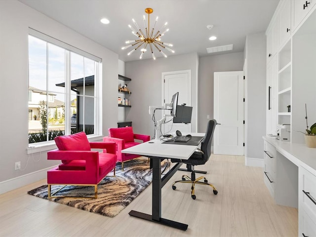 office area featuring light hardwood / wood-style flooring, a wealth of natural light, and a notable chandelier