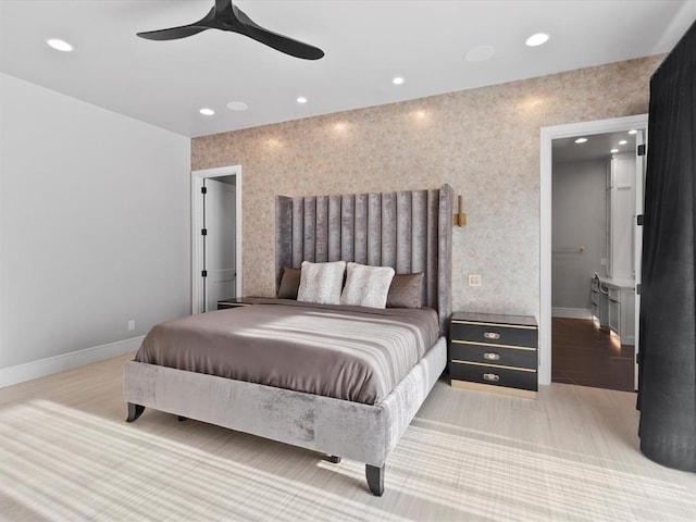 bedroom with ceiling fan and light hardwood / wood-style floors