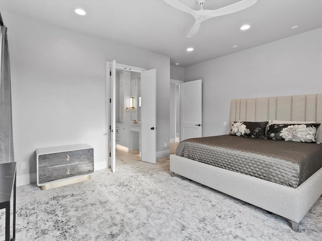 bedroom with carpet flooring, ensuite bath, and ceiling fan