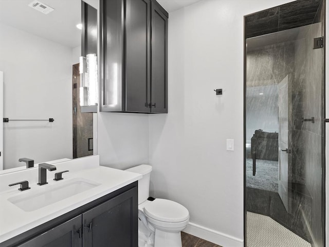 bathroom with a shower with door, vanity, wood-type flooring, and toilet