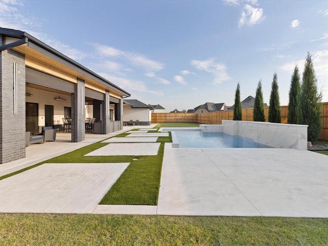 view of pool featuring a patio