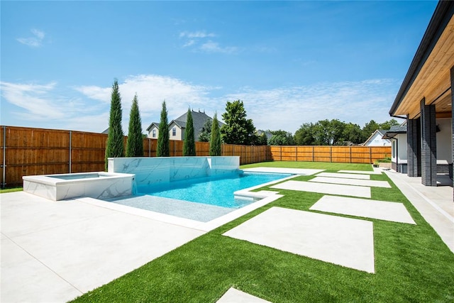 view of swimming pool with an in ground hot tub, a yard, and a patio area