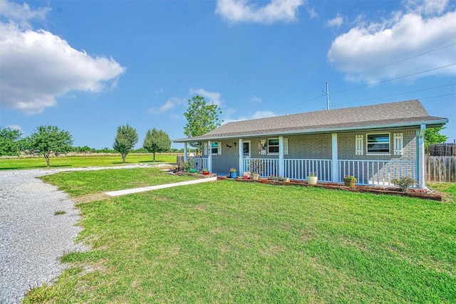 ranch-style house with a porch and a front yard