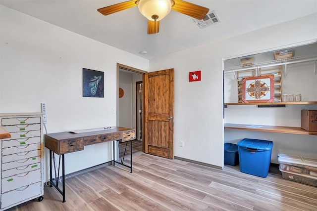 miscellaneous room featuring ceiling fan and light hardwood / wood-style flooring