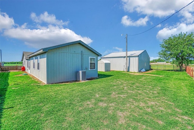 exterior space with central AC and an outdoor structure