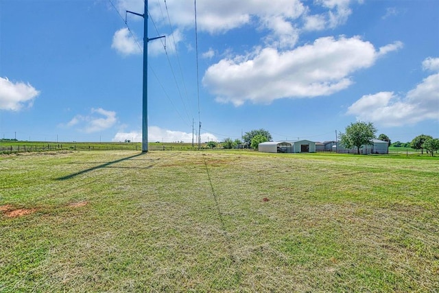 view of yard with a rural view