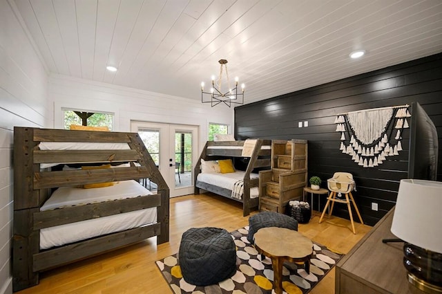 45 Pecan Trace Trl, Broken Bow, OK 74728 - bedroom featuring a chandelier, light wood-type flooring, wooden ceiling, french doors, and access to exterior