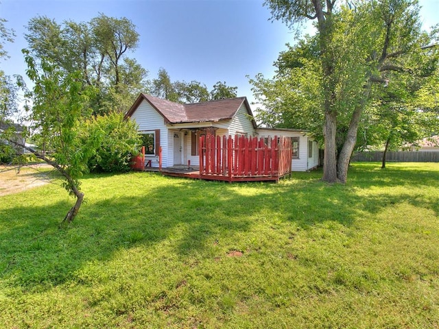 exterior space with a yard and a deck