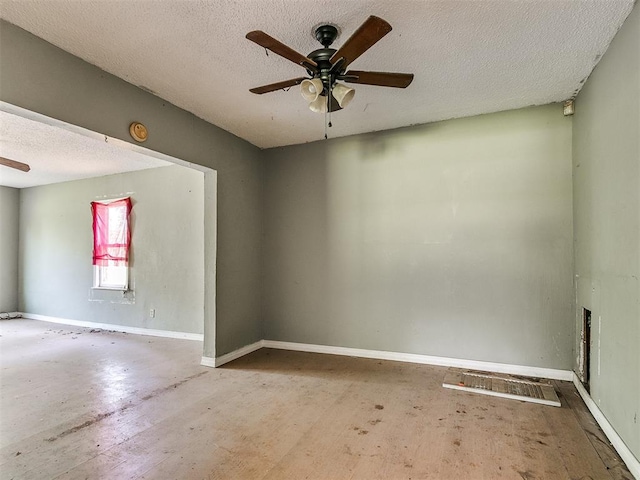 spare room with ceiling fan and a textured ceiling