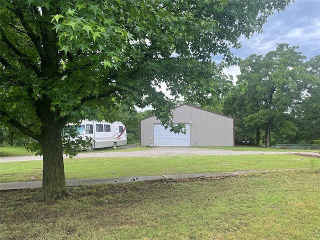 view of yard featuring an outbuilding and a garage