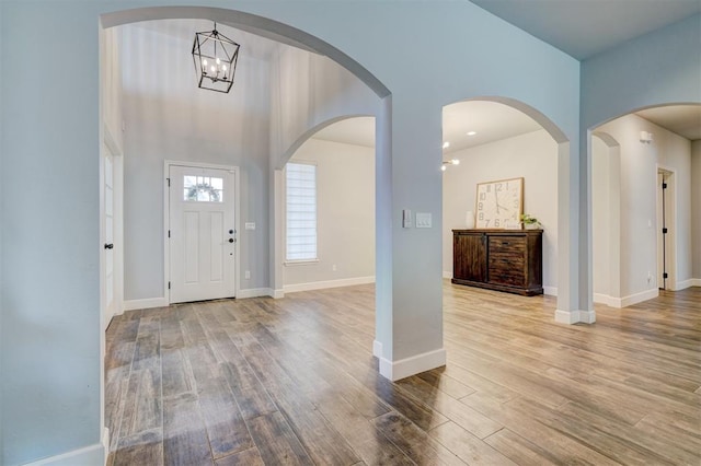 entryway featuring a notable chandelier and light hardwood / wood-style floors