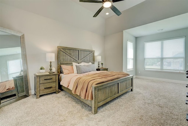 bedroom featuring light carpet and ceiling fan