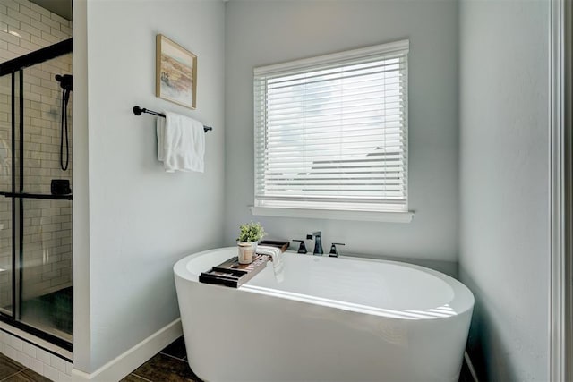 bathroom featuring plus walk in shower and tile patterned floors