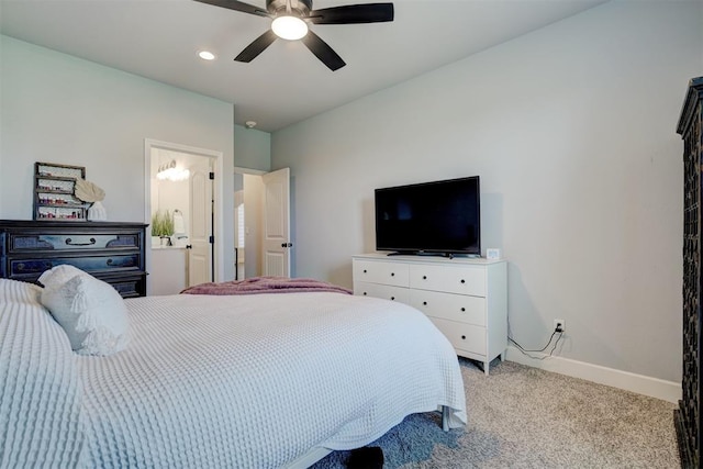 bedroom featuring ceiling fan, ensuite bathroom, and light carpet