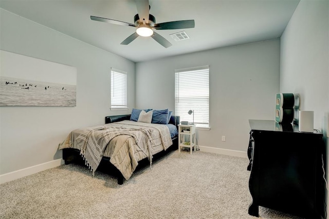 bedroom featuring light carpet and ceiling fan