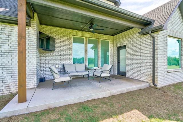 view of patio with outdoor lounge area and ceiling fan