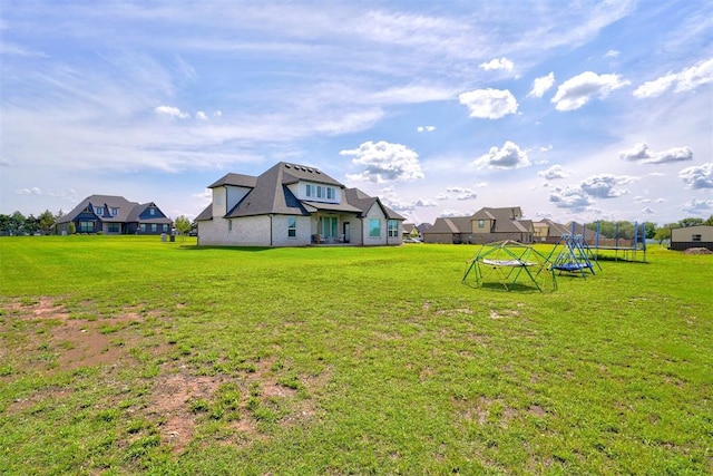 view of yard with a trampoline