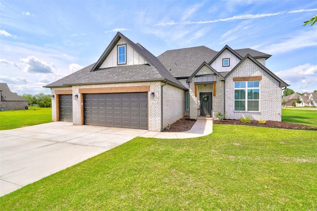 view of front of property featuring a front yard and a garage