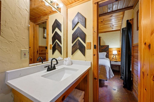 bathroom featuring vanity, concrete floors, and wooden ceiling