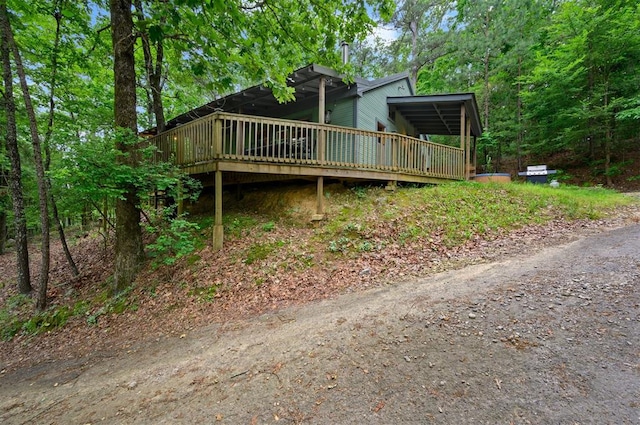 view of side of property with a deck