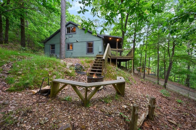 back of property featuring a wooden deck