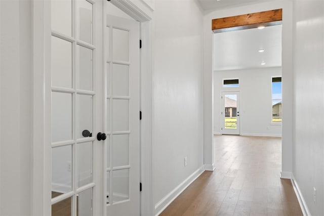 hallway featuring hardwood / wood-style flooring