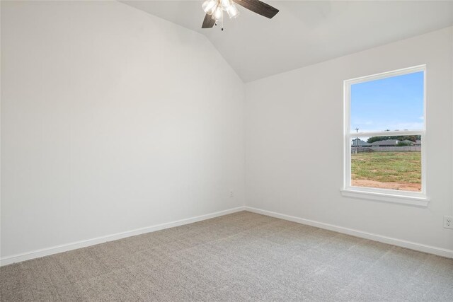 unfurnished room featuring carpet, ceiling fan, and lofted ceiling