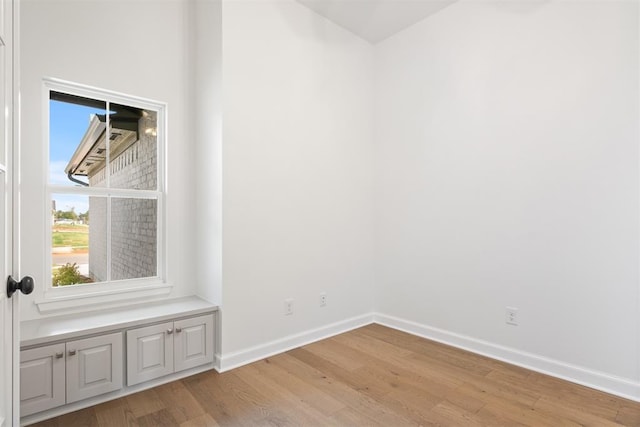 unfurnished room with light hardwood / wood-style floors