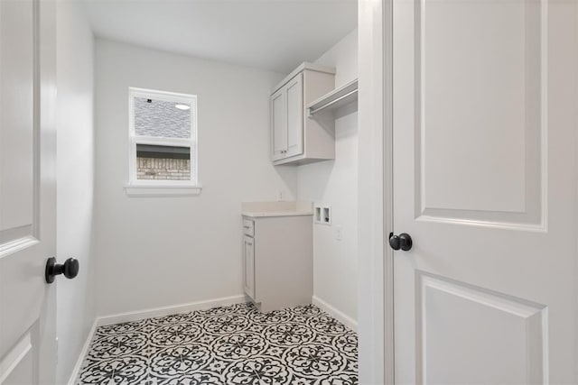 washroom with cabinets and washer hookup