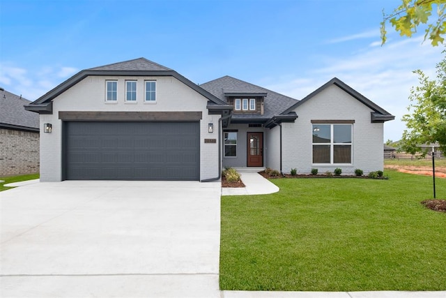 view of front of house featuring a front yard and a garage