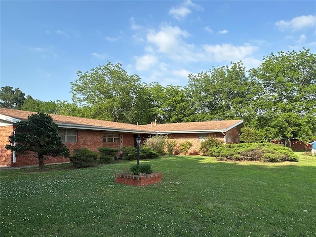 ranch-style house with a front lawn