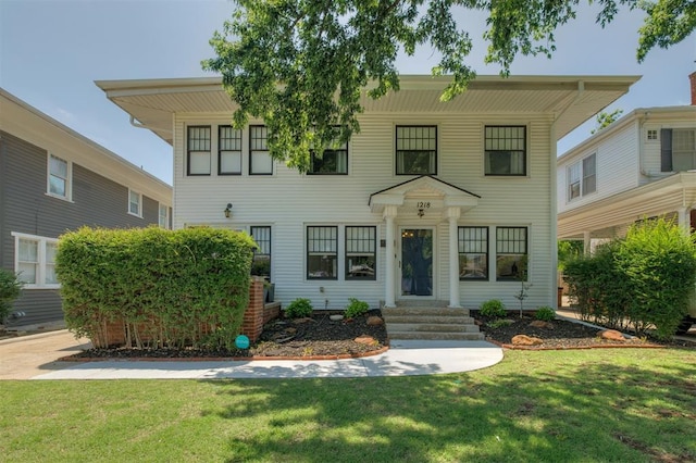 view of front facade with a front lawn