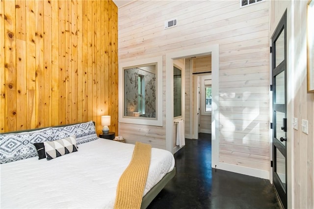 bedroom featuring a high ceiling and wood walls