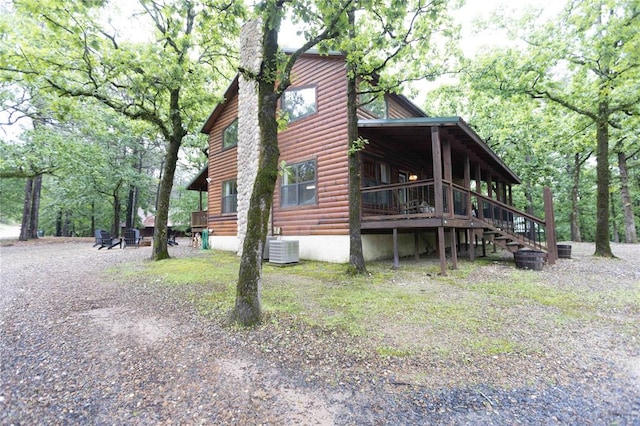 view of side of property with cooling unit